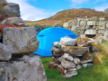 Sheltered tent pitch