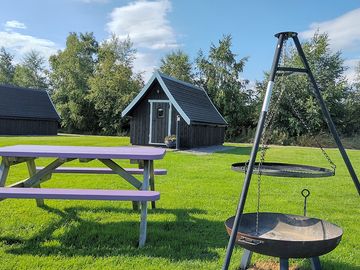 Each pod has a fire pit and picnic table