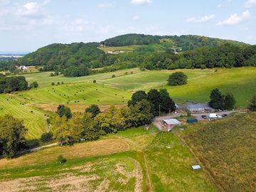The site surrounded by farmlands