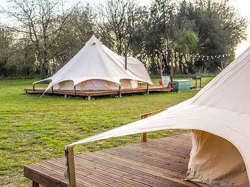 The luxury bell tents are on a beautiful deck and both have their own privacy outside deck