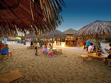 Enjoy a drink at the beach bar