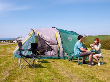 Tent pitch on grass with electric hook-up