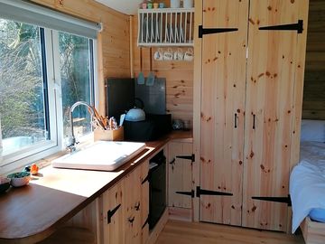 Kitchen including belfast sink, gas hob and fridge
