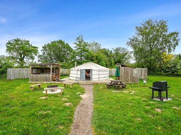 Exterior of the yurt and the hot tub