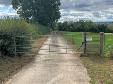Gate with padlock for guest access