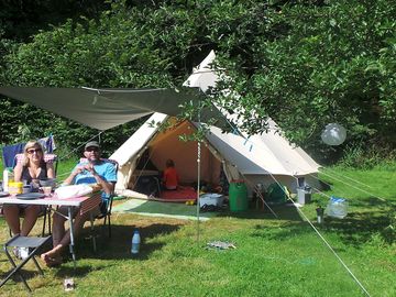 Surrounded by grass and trees