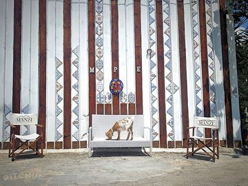 Goats wander freely around the grounds