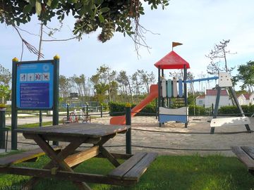 Picnic tables overlooking the play area