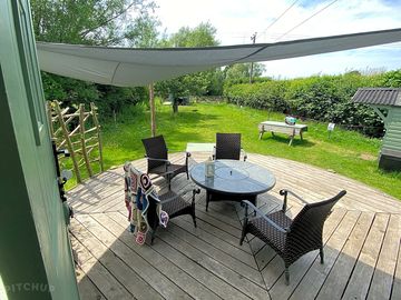 Decking, seating and private field to shepherds hut