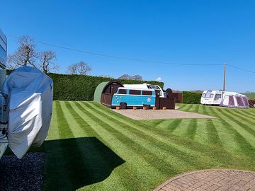Glamping pods and pitches are integrated throughout the site