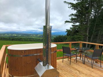 Heather's woodfired hot tub and outdoor seating area