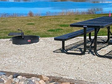 Each site includes a metal picnic table and fire ring