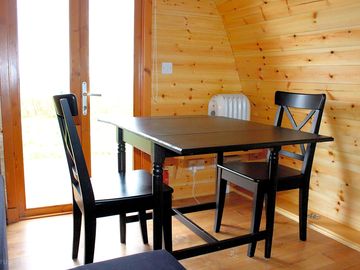 Table and chairs inside the pod