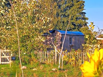 Set in a small garden among fields and pastures