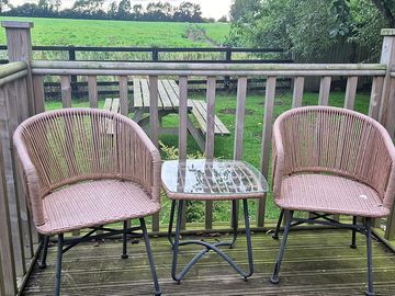 Veranda outside the hut with peaceful countryside views and with private seating