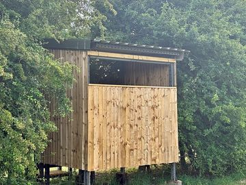 On site bird hide overlooking neighbouring wetlands!