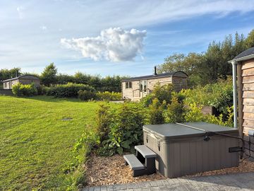 View from outside the sett looking towards the next hut