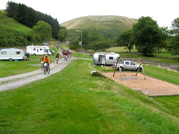 Cyclists leaving the campsite for the day