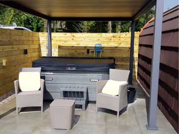 Outdoor area with hot tub
