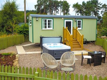 Exterior of the shepherd's hut showing hot tub
