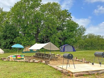 Communal barbecue area with covered seating