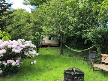 The garden with firepit and hammock
