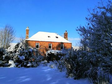 Our farmhouse in the snow