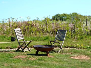 Each site has their own table/chairs and firepit.