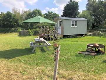 A view from a new apple tree on a beautiful day in the hut paddock