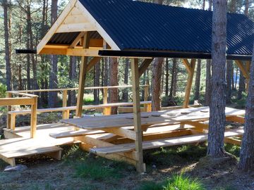 Covered seating area with electric light