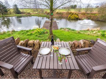 Outdoor seating overlooking the lochan