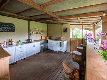 Kitchen: gas hobs, sink, breakfast bar with wildlife