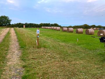 Hay bales on the approach to the site
