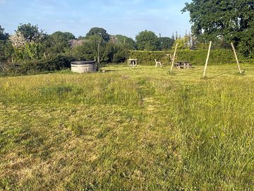 Paths and pitches cut in a hay meadow; designed to be productive; biodiverse; and host.
