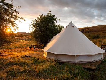 The bell tent faces a lovely sunset