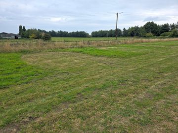 Mowed pitches seperated by wild meadow.