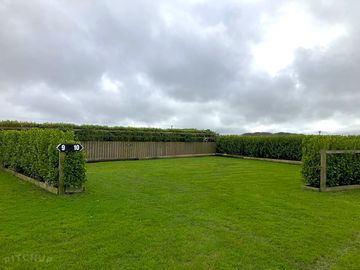Front view of entrance to serviced grass pitch