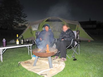 Guests relaxing by the firepit