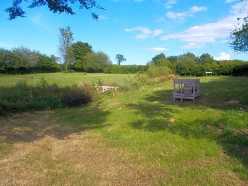 Grass pitches surrounded by greenery