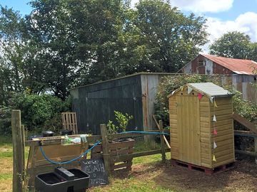 View of composting toilet and hand wash area