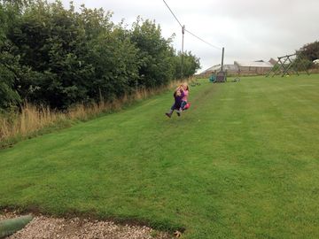 The children's play area with a huge zipwire, four swings and a see saw