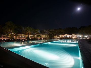 The swimming pool lit up at night