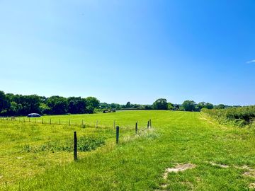 Spacious pitch with views of the Purbeck Hills and Wareham