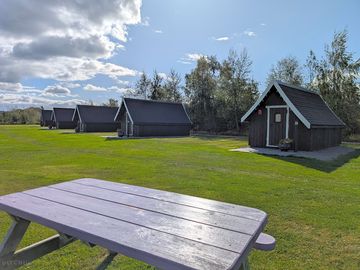 Each pod has a fire pit and picnic table
