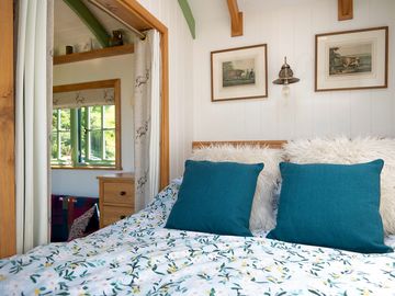 A king-size bed awaits — soft, spacious, and perfect for romantic nights in.