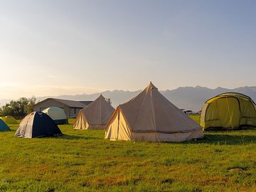 Tent pitches at sunset