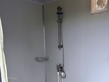 Wide-access shower and toilet
