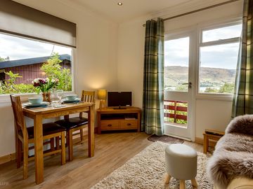 Living room with tv, free wifi and loch views