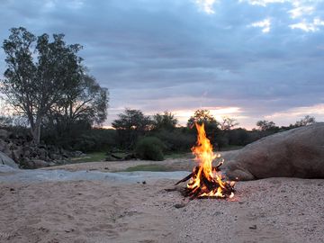 Campfire in a dry riverbed