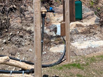 Drinking water tap and electrical outlet for phone charging